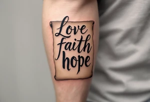 Tattoo with black calligraphy love faith hope on a parchment-scroll background in faded tan and beige tones. tattoo idea