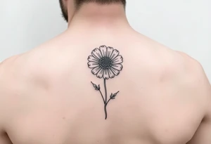 Minimalists marigold flower with g tattoo idea