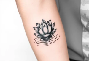 serene lotus flower emerging from sacred waters with ripples tattoo idea