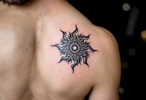 With spirals of cobalt and charcoal, this Celtic sun combines sky and shadow on the upper arm. tattoo idea