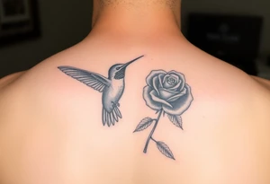 Debby Deguzman with a humming bird and a rose tattoo idea