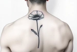 Poppy flower small fine line spine tattoo tattoo idea