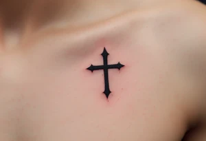 A small, sharp-edged black cross tattoo placed just beneath the outer corner of the eye, with subtle red shading around the lines to give it a raw, rebellious aura. tattoo idea