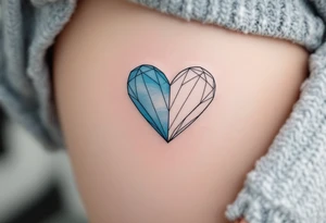 A two-tone heart, half sky blue and half white, featuring the name Filípek. tattoo idea