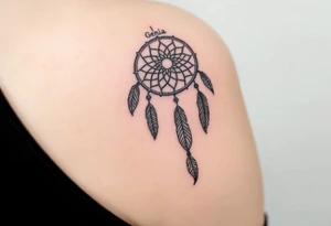 native dreamcatcher with flowing feathers and sacred beads with name Genia in it tattoo idea