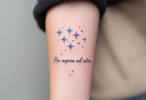 A celestial forearm piece features “Per aspera ad astra” in silver cursive beneath blue-and-purple watercolor stars. tattoo idea