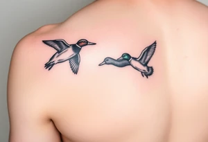 ducks flying in a swmap on outside of forearm with a wood duck and mallard tattoo idea