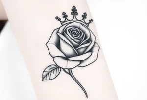 A rose with a large crown on-top of it tattoo idea