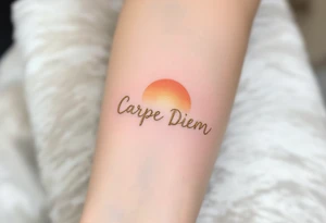 "Carpe Diem" in cursive gold ink with a sunrise gradient of soft oranges and yellows rising behind it. tattoo idea