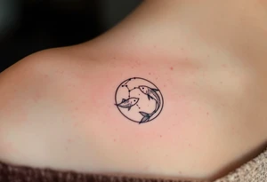 A fine-line Pisces constellation is overlaid on a soft pink moon, capturing the emotional depth of the zodiac. tattoo idea