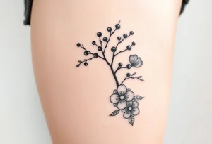 rowan tree tattoo with berries and large florals tattoo idea