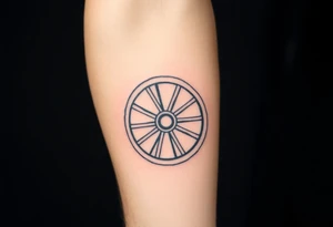 Wagon wheel with busted spokes tattoo idea