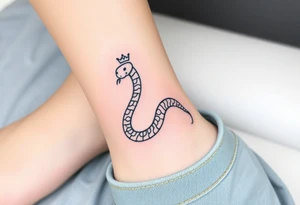 I want a small simple silhouette lines black and white wrist princess like girl snake tattoo that has number 12821 on its body along and also I want it to represent feminine energy crown queen Cycle tattoo idea