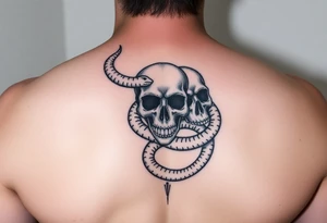 stack of skulls with a serpent wrapping around tattoo idea