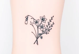 Bouquet of birth months flowers Lilly of the valley, daffodil, larkspur and Ilex aquifolium with berries tattoo idea