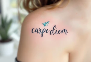 Flowing script in ink-wash gray "carpe diem", with a paper plane in pale blue flying above the phrase. tattoo idea