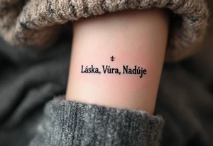 Bold typewriter-style "Láska, Víra, Naděje" in deep charcoal, with a faint heart, cross, and anchor drawn behind each word. tattoo idea