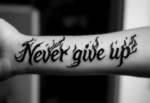 "Never give up" in fiery red ink with flames licking up from the letters. tattoo idea