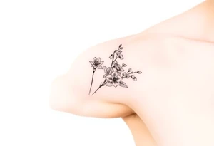 Feminine daffodils, Lily of the valley and larkspur bouquet tattoo idea