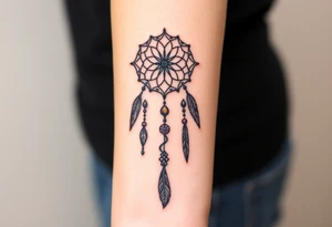 native dreamcatcher with flowing feathers and sacred beads tattoo idea