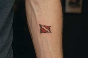 tattered dive flag tattoo idea