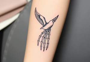 Skeleton hand reaching out of the ocean for a flying swallow tattoo idea