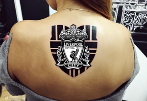 Small tattoo for a woman who love the Liverpool city, I would like to write the name of the city creating a heart shape tattoo idea