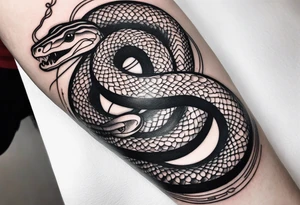 a tattoo of a writhing snake on a forearm tattoo idea