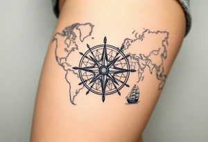 antique compass rose overlaid on weathered world map with sailing ships tattoo idea