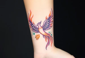 Phoenix with blazing flames with purple, orange, teal and green splashes tattoo idea