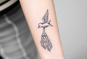 Skeleton hand reaching out of the ocean for a flying swallow tattoo idea
