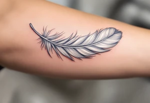 A single soft grey feather drifting down the forearm, capturing the lightness of freedom. tattoo idea