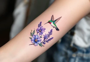 A hummingbird hovering near blooming lavender flowers, with shimmering emerald and violet tones. tattoo idea