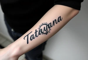 Forearm tattoo for a man using the name “Tatayana” Starting from the wrist, stretching to the elbow with the sun and moon tattoo idea