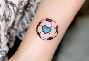 A minimalist black outline of a soccer ball with a single blue heart at its center. tattoo idea