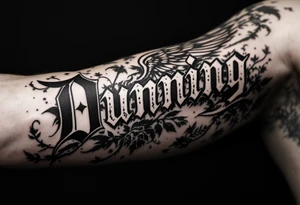 Dunning,on left forearm details include angel wing, greek type of font,jungle leaves , tiger claw scratch tattoo idea