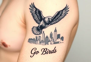 Philadelphia Eagle flying toward front over Philadelphia city skyline faded with a Go Birds written under it tattoo idea