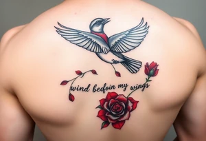 Soaring robin with trail of red rose petals with writing saying wind beneath my wings tattoo idea