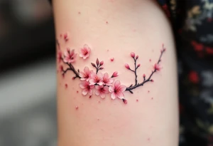 A pink cherry blossom branch gently falling across the skin, symbolizing the fleeting nature of life. tattoo idea