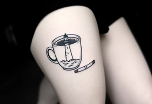 A mug of coffee
 with a picture of a 
 lighthouse on the the mug and a cigarette laying next to it tattoo idea