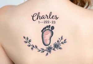 baby footprint print with the name Charles above it, the date 1-14-23 below it and surrounded by floral vines on a forearm tattoo idea