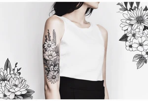 Forearm sleeve with cactus, daisies, and greenery tattoo idea