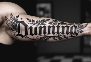 Dunning,on left arm details include angel wing, greek type of font,jungle leaves , tiger claw scratch tattoo idea