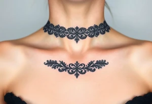 A black lace border wrapping around the collarbone, creating a sophisticated and timeless look tattoo idea