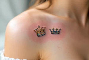 Gold-inked two royal queen and king crowns with tiny emerald and ruby details. tattoo idea
