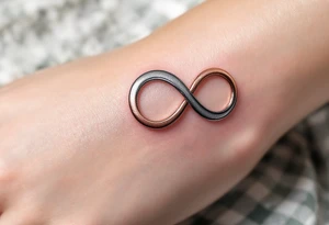 A metallic infinity symbol with engraved initials, reflecting chrome silver and rose gold, emphasizing an unbreakable bond. tattoo idea