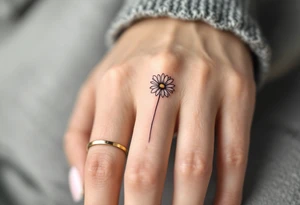 A band around finger with a single engraved daisy tattoo idea