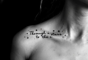 A minimal black line script of the english phrase “Through Hardships to the stars” is paired with tiny gold stars scattered along the collarbone. tattoo idea