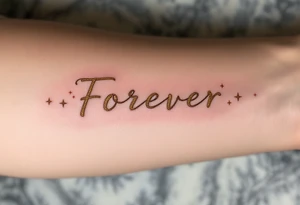 "Forever" etched in gold metallic ink across the spine, surrounded by tiny celestial stars. tattoo idea