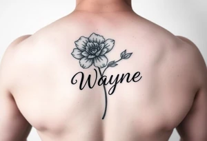 flower with a stem turning into the name wayne in cursive on rib cage tattoo idea